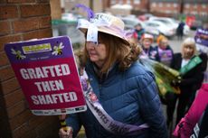 A Waspi campaigner holds a placard