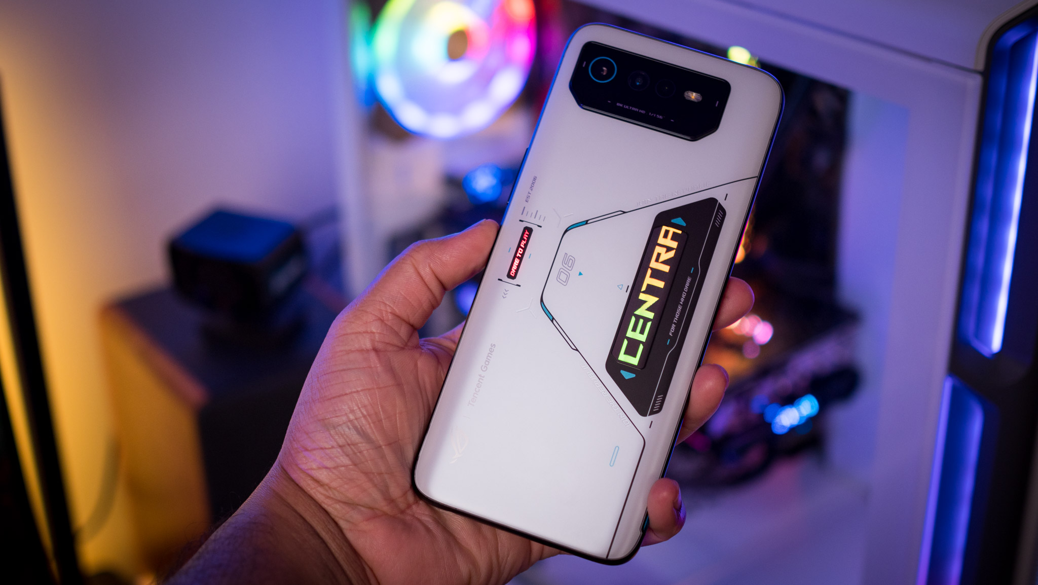 ASUS ROG Phone 6 Pro held in one hand showcasing its backside
