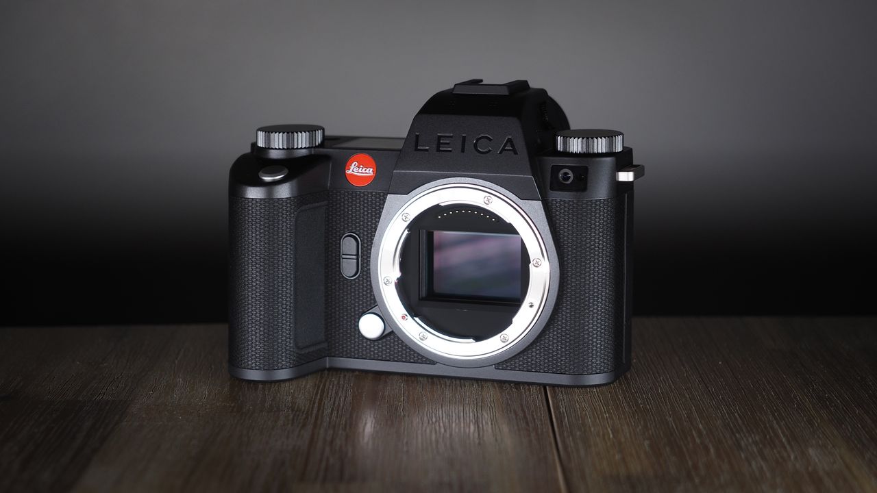 Leica SL3-S on a wooden surface with moody lighting