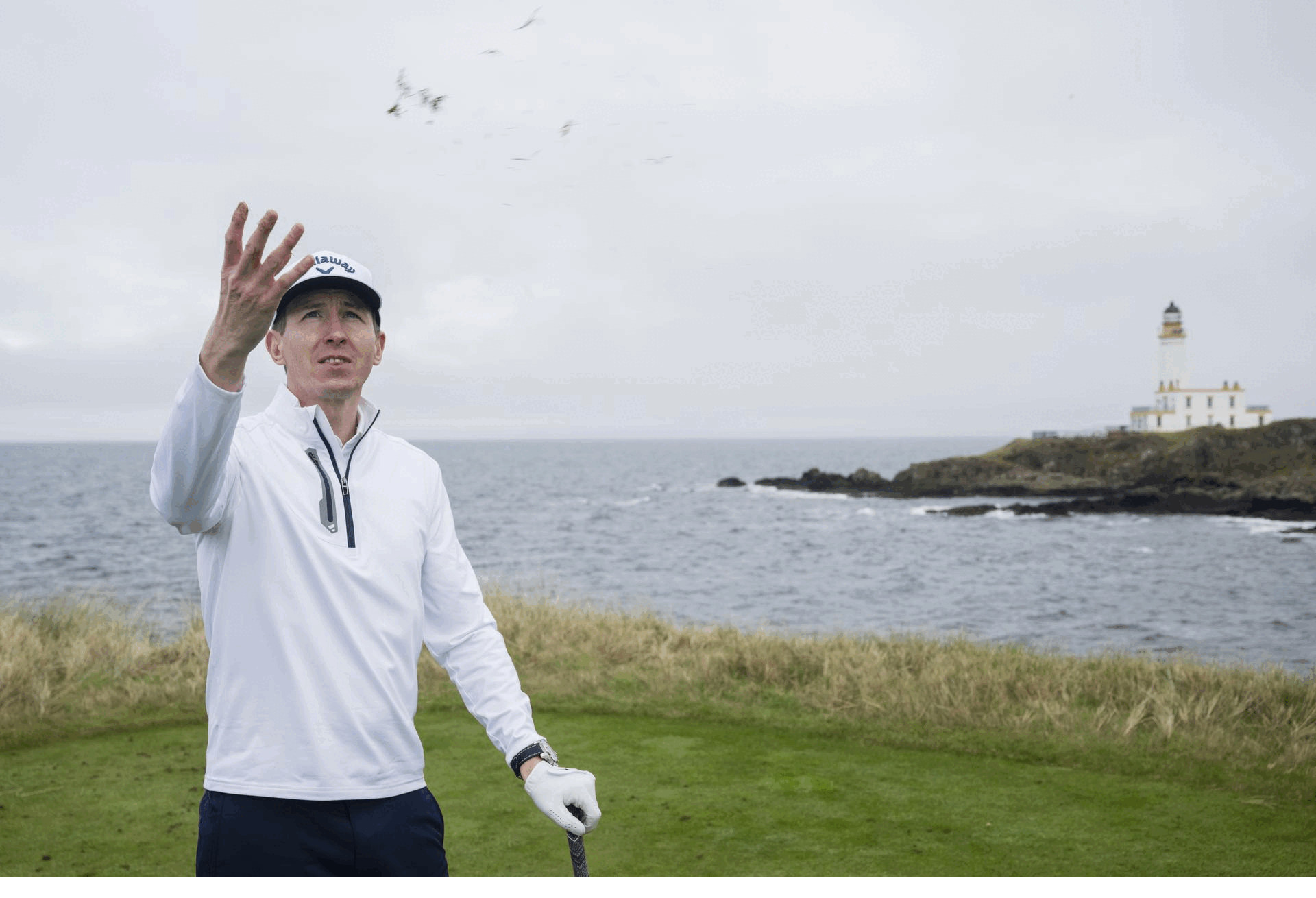 A GIF of Ben Emerson going through his routine on the tee box, checking the wind, aligning his shot, picking a line and hitting a shot towards the par-3 9th hole with the famous lighthouse in the background