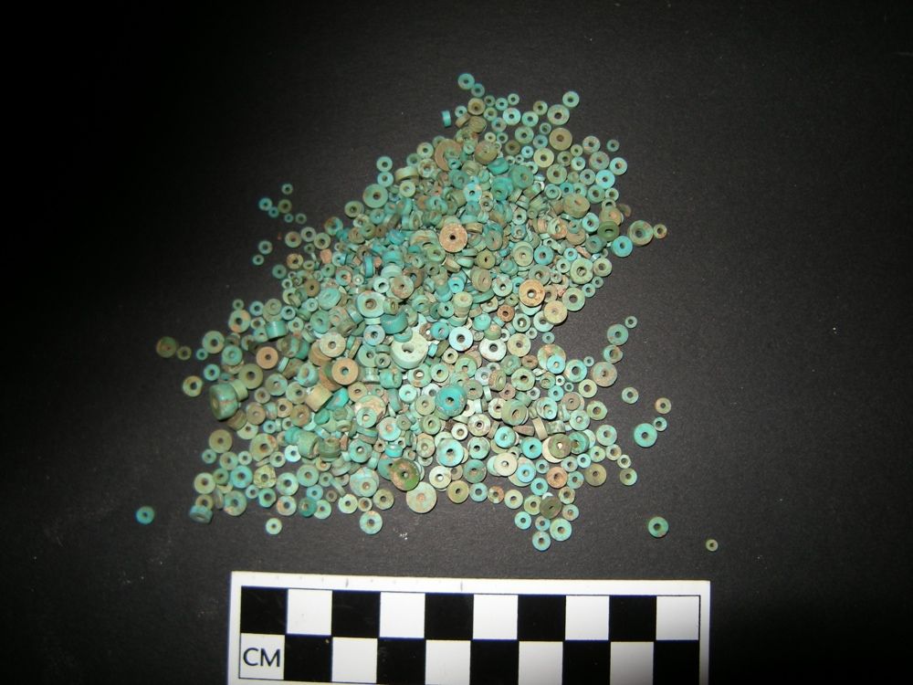 Here, turquoise beads recovered from early excavations at Pueblo Bonito, the largest great house in Chaco Canyon. 