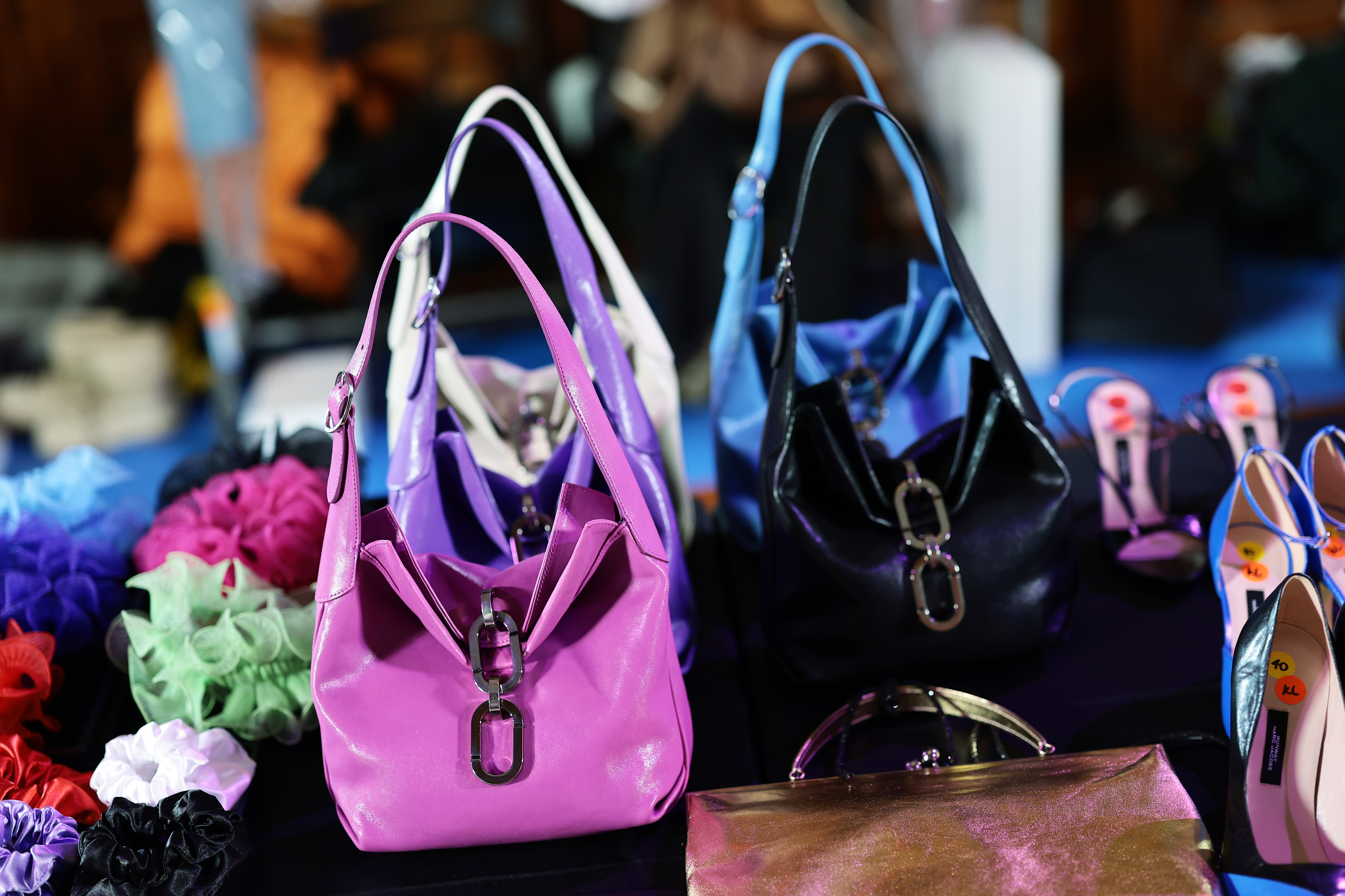 a black table with colorful bags and scrunchies