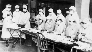 Women working for the Red Cross make masks during the Spanish flu pandemic in 1918