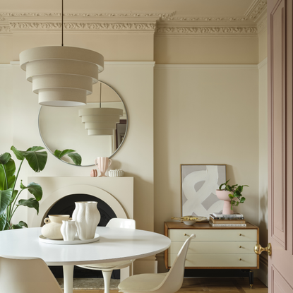 Dining room which has a colour capping paint scheme which transitions from cream to beige.