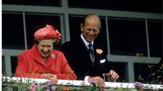 Queen Elizabeth ii and Prince Philip, Duke of Edinburgh watch the Derby on June 7, 1989 in Epsom, England