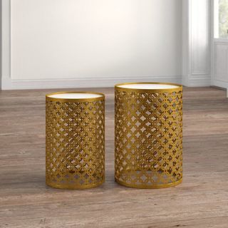 Two different height gold end tables a part of Kelly Clarkson's furniture collection.