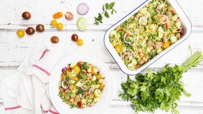 couscous flatlay with tomatoes, salad and mint