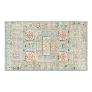 A Persian style accent rug in green