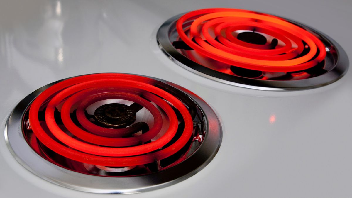 Electric stove top burners glowing with heat