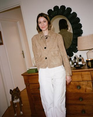 @ruerodier wearing a suede jacket with white trousers