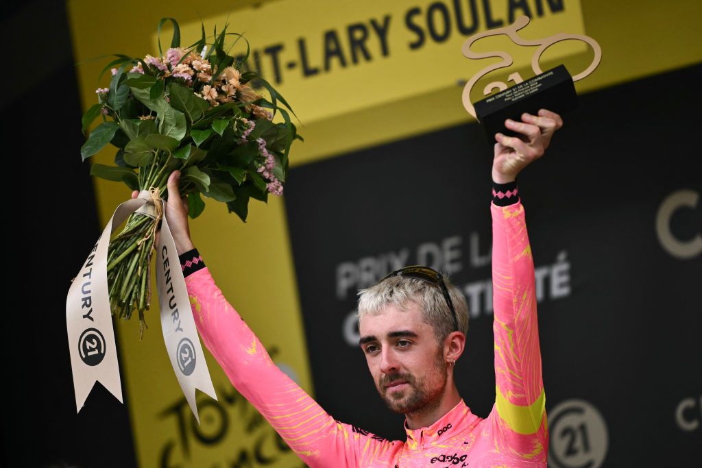 EF Education - EasyPost team's Irish rider Ben Healy celebrates on the podium with the most combative rider's award after the 14th stage of the 111th edition of the Tour de France cycling race, 151,9 km between Pau and Saint-Lary-Soulan Pla d'Adet, in the Pyrenees mountains in southwestern France, on July 13, 2024. (Photo by Marco BERTORELLO / AFP)