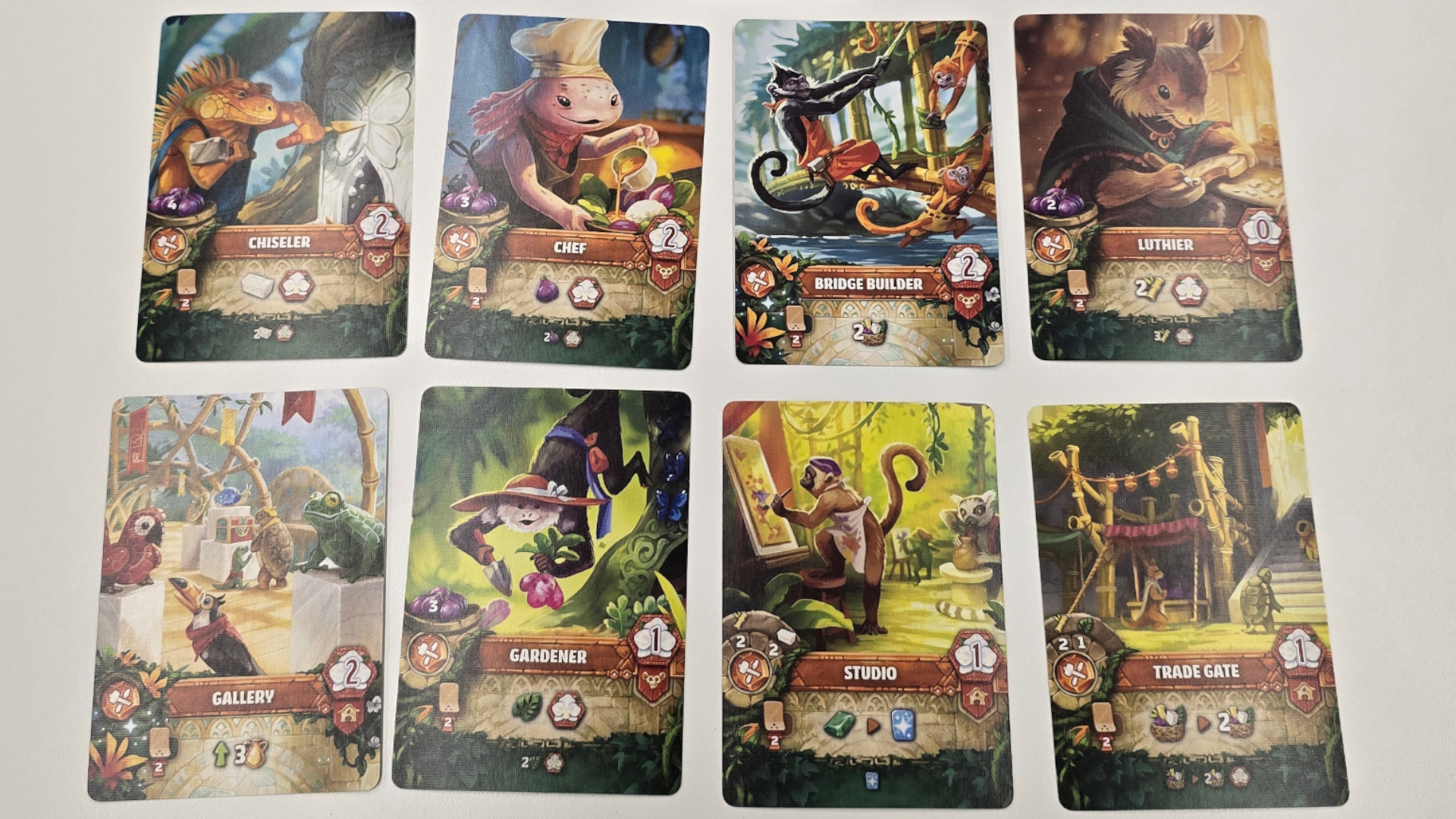 Emerland cards laid out in rows on a white surface