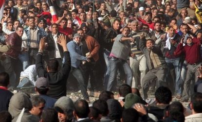 Anti-government protesters clash violently with supporters of President Mubarak. 