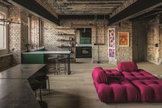 Camaleonda sofa by Mario Bellini for B&B Italia upholstered in Ego Bordeaux. Hanging Nest Egg chair and cushions by Studio Sterling. Icelandic sheepskin rug by Cuero Interiors from Etsy.