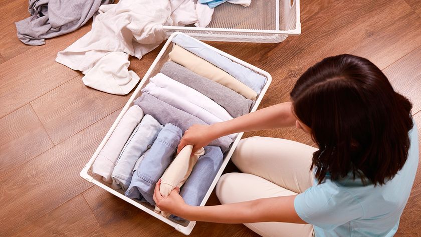 Decluttering clothes in a bedroom
