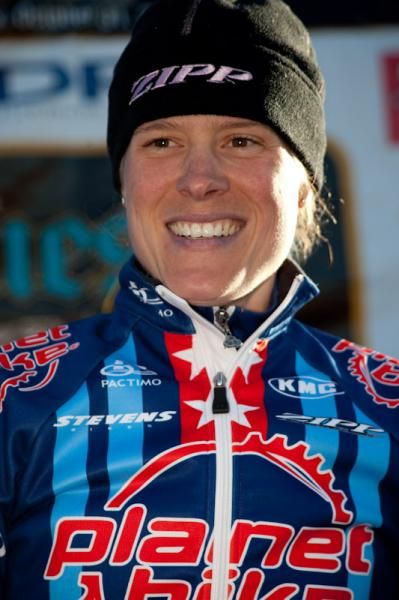 Katie Compton (Planet Bike) all smiles on the podium.