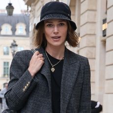 Keira Knightley wore a bucket hat with the Chanel 25 bag during Paris Couture Week