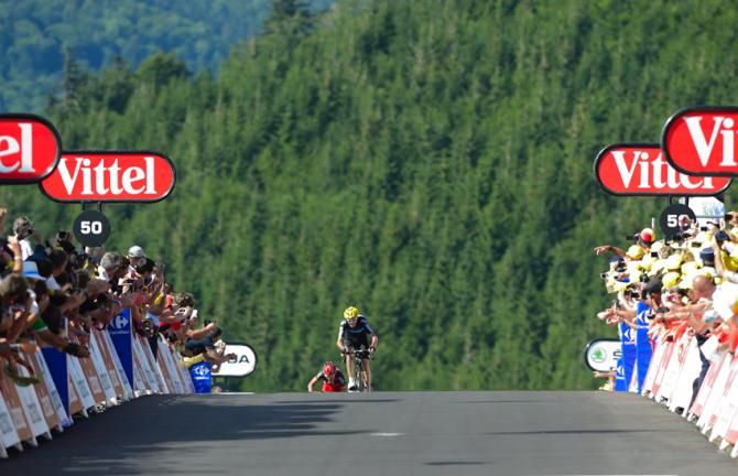 Chris Froome wins the stage at La Planche des Belles Filles. Behind Froome, Cadel Evans of team BMC takes second