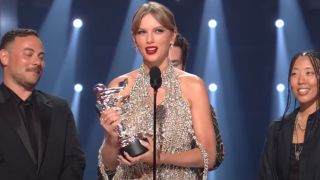Taylor Swift accepting an award at the VMAs in 2022.