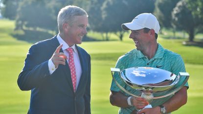 PGA Commissioner Jay Monahan (left) laughs with Rory McIlroy (right) after McIlroy won the PGA Tour Championship on Sunday, August 28, 2022