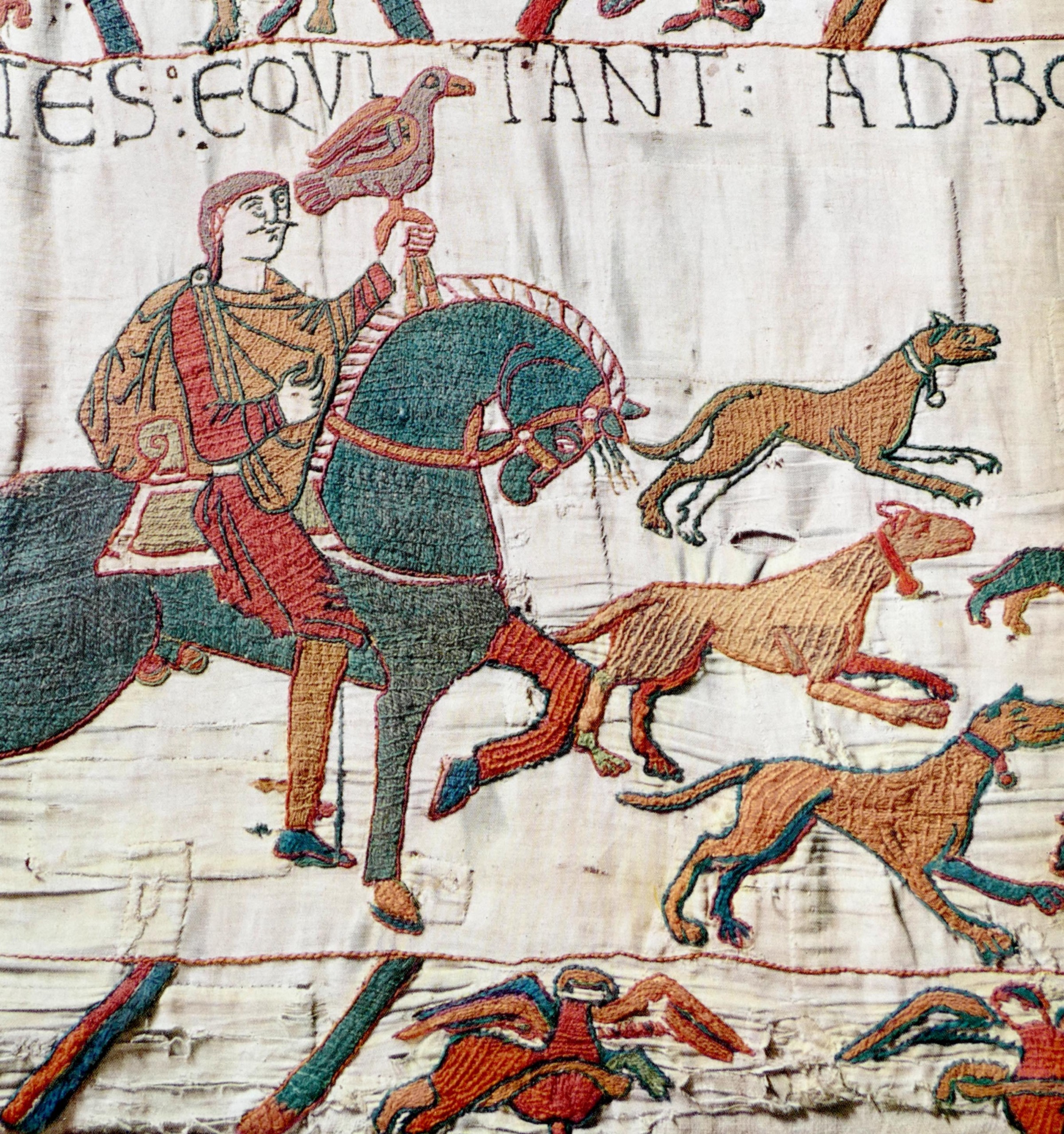 King Wililam on his horse, holding a bird of prey, surrounded by dogs