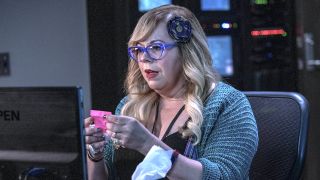 Penelope Garcia holding pink note in office in Criminal Minds: Evolution
