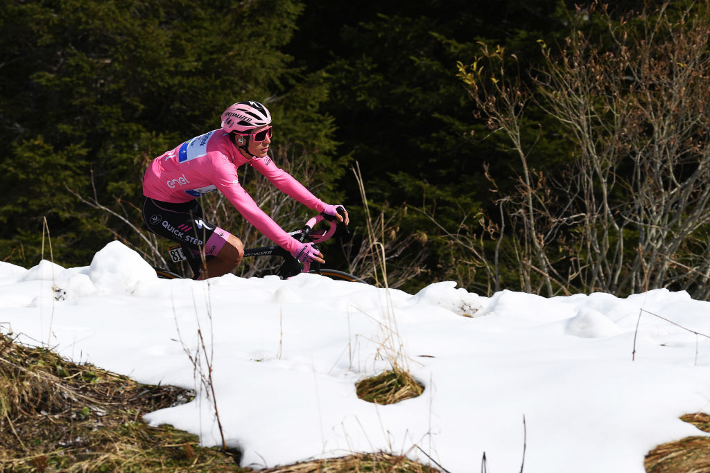 MADONNA DI CAMPIGLIO ITALY OCTOBER 21 Joao Almeida of Portugal and Team Deceuninck QuickStep Pink Leader Jersey Forcella Valbona 1782m Snow Mountains during the 103rd Giro dItalia 2020 Stage 17 a 203km stage from Bassano del Grappa to Madonna di Campiglio 1514m girodiitalia Giro on October 21 2020 in Madonna di Campiglio Italy Photo by Tim de WaeleGetty Images