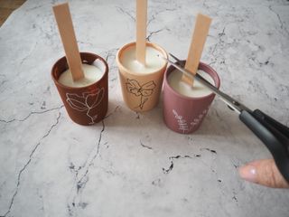 Trimming wooden wicks for homemade candles
