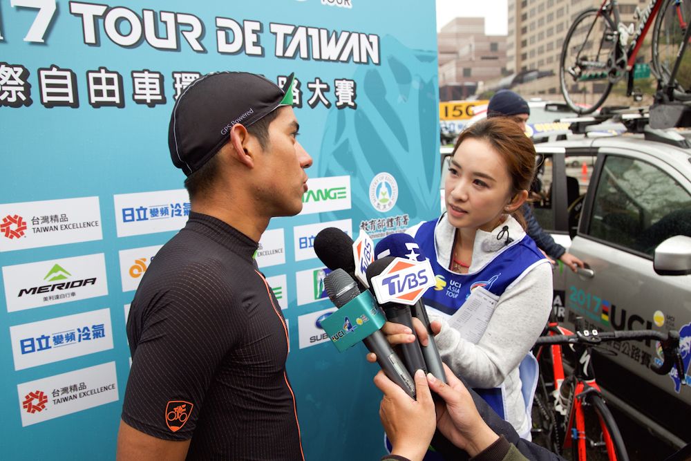 Edwin Avila speaks with media after winning stage 1 at the Tour de Taiwan