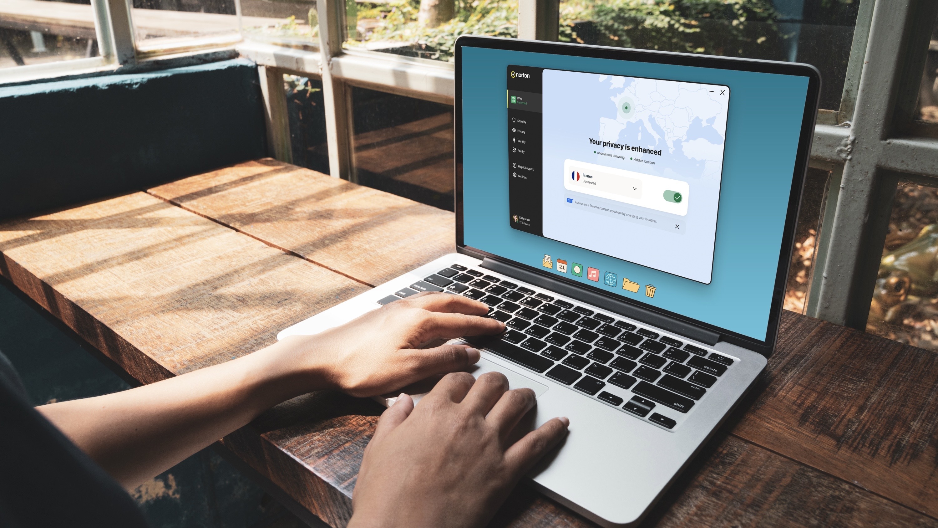 Person using Norton VPN in a laptop - promo image