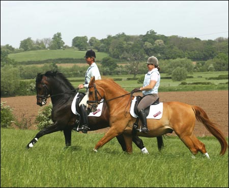Carl Hester and Pippa Funnell enjoy a hack