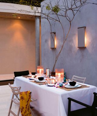 wall lights in modern minimal courtyard dining scene