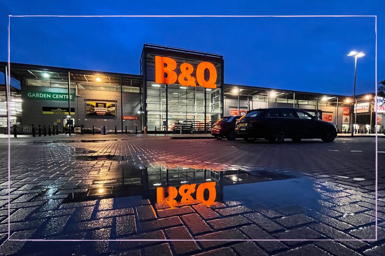 a long shot of a B&amp;Q store at night next to a car park