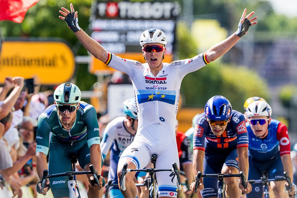 Belgian Tim Merlier of Soudal Quick-Step celebrates as he crosses the finish line to win stage nine of the 2025 Tour de France cycling, from Chinon to Chateauroux (170 km), on Sunday 13 July 2025 in France. The 112th edition of the Tour de France starts on Saturday 5 July in Lille, France, and will finish in Paris, France on the 27th of July. BELGA PHOTO JASPER JACOBS (Photo by JASPER JACOBS / BELGA MAG / Belga via AFP)
