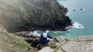 how to start sea cliff climbing: climber above the sea