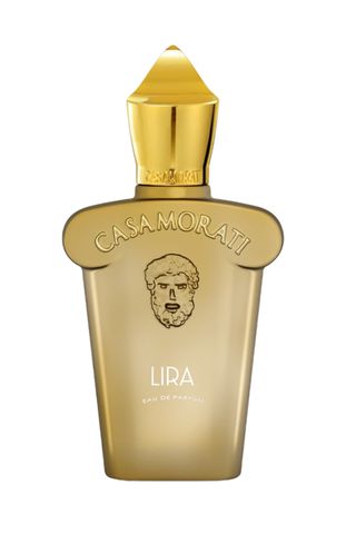 Casamorati Lira Eau De Parfum in matte gold bottle with embossed with shape of a bearded man's head and Casamorati with metallic gold pointed cap on white background 