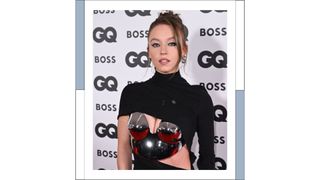 Sydney Sweeney wears a black dress and silver breastplate as she attends the GQ Men Of The Year Awards 2022 at Mandarin Oriental Hyde Park on November 16, 2022 in London, England