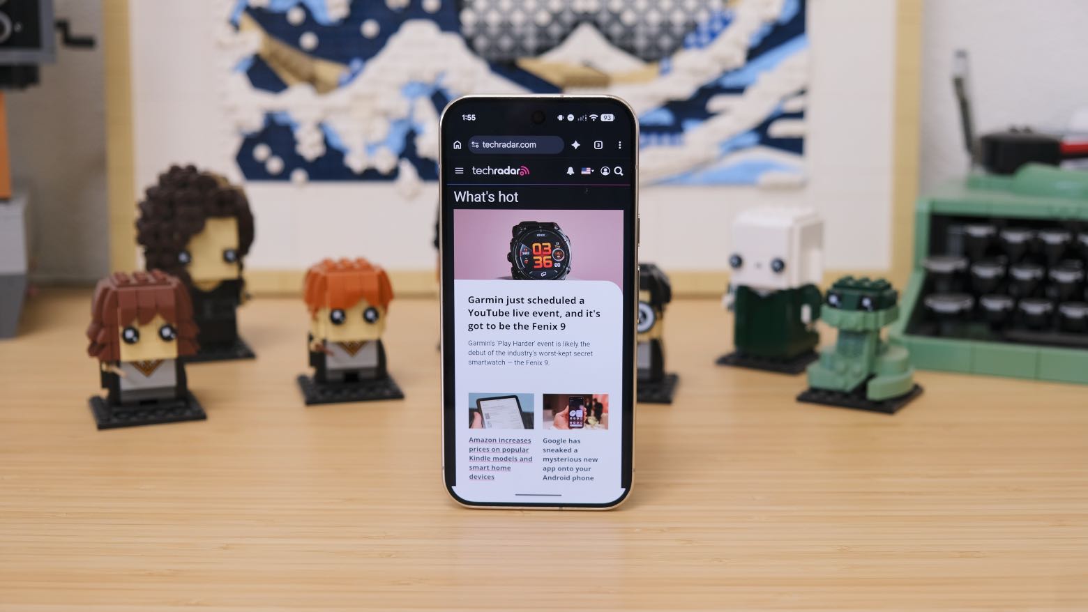 The Google Pixel 11 Pro resting on a wooden table