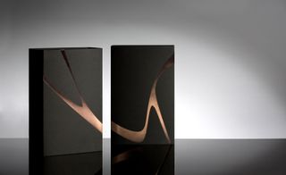 Zaha Hadid packaging, black with rose gold accents