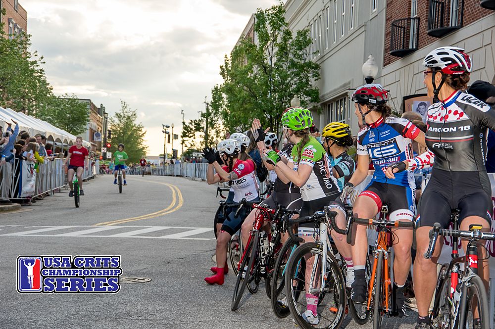 The Women cheer on the finishing uni-cycle event before beginning their race