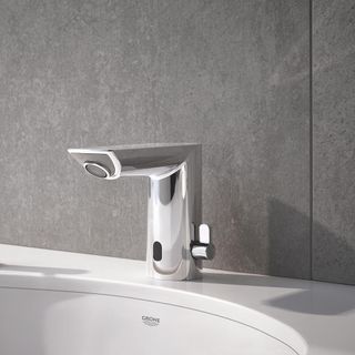 bathroom with grey wall and silver tap