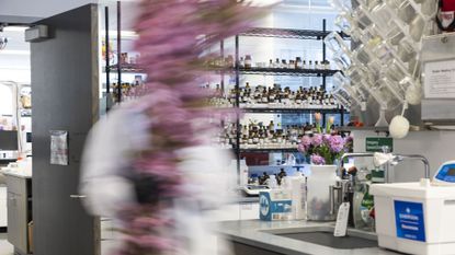 blur of a figure in lab coat