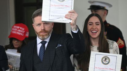 Political commentator Rogan O'Handley (C), aka DC Draino, US influencer Jessica Reed Kraus (L) and Chaya Raichik (R) carry binders bearing the seal of the US Justice Department reading "The Epstein Files: Phase 1" as they walk out of the West Wing of the White House in Washington, DC, on February 27, 2025.