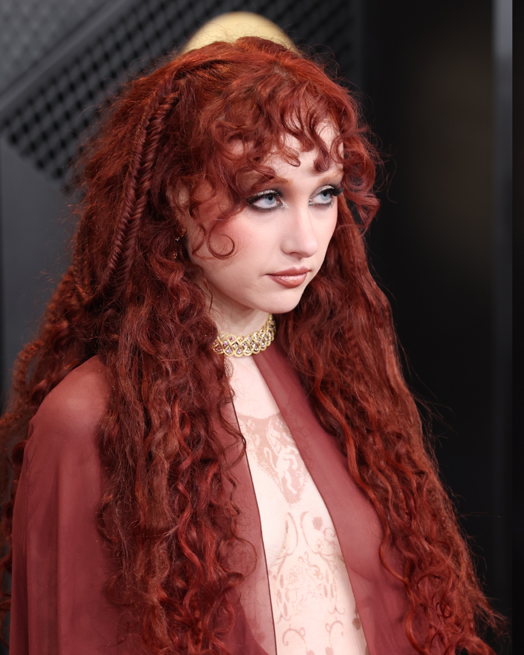 Chappell Roan with tousled curls and ultra-defined eyes at the 2026 Grammys Awards