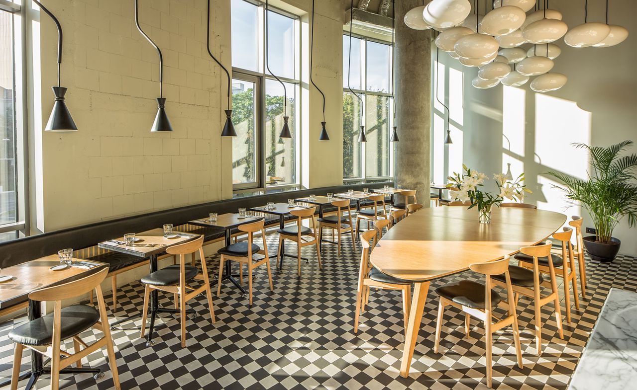 Tables &amp; chairs on monochrome checked floor