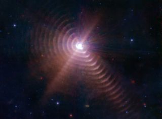 Every eight years, the two stars in WR140 produce another ring of dust as they pass each other in orbit.