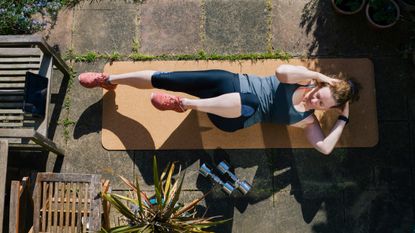 Woman doing exercise stacking small habits to lose weight