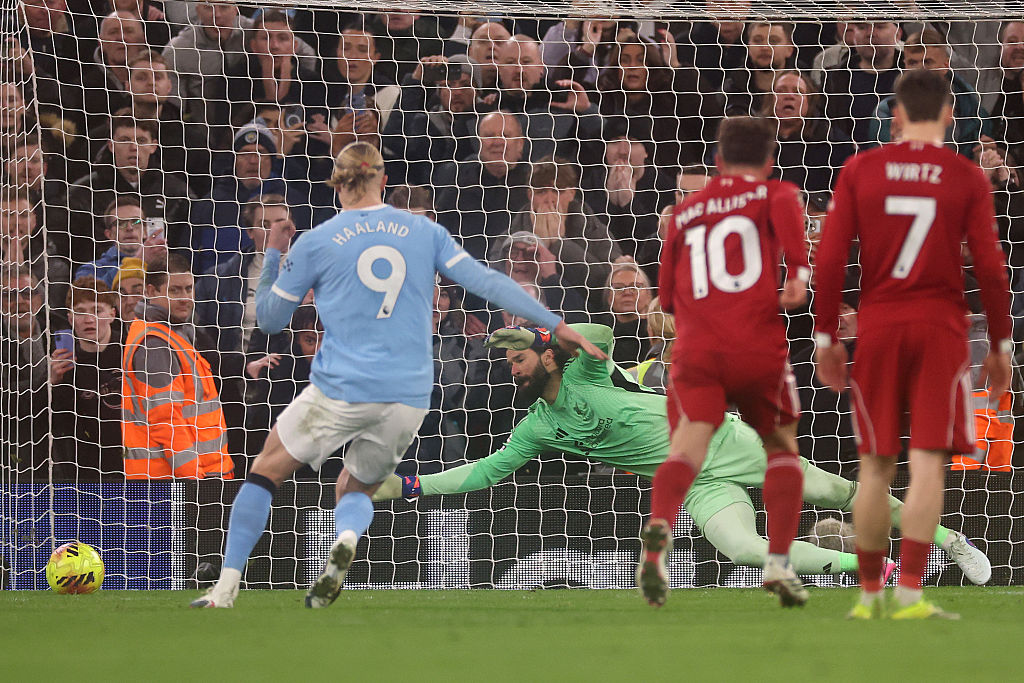 Alisson Becker of Liverpool fails to make a save as Erling Haaland of Manchester City scores his team's second goal from the penalty spot during the Premier League match between Liverpool and Manchester City at Anfield on February 08, 2026 in Liverpool, England.