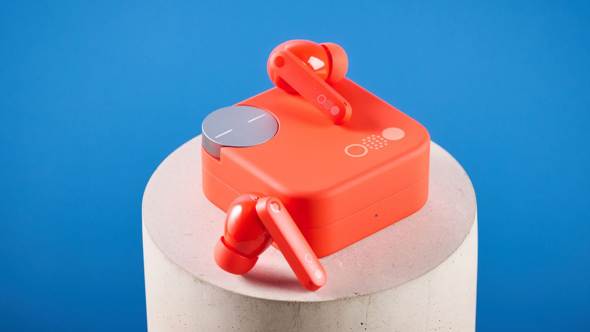 the nothing cmf buds pro 2 cmf by nothing buds pro 2 in bright orange shown in the smart dial charging case against a blue tom's guide background