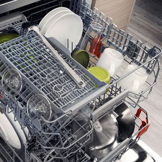 dishwashers inside with cups and plates